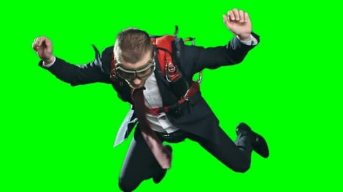 Man in Suit Skydiving in front of Greenscreen