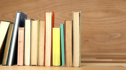 Various books arranged on a table