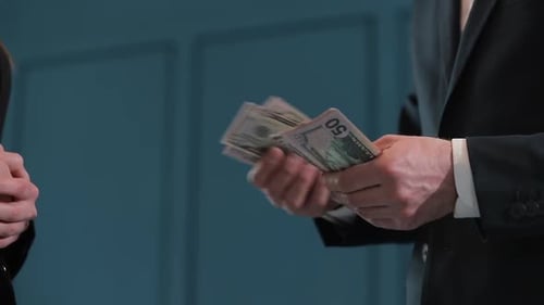Businessman Counting Dollar Banknotes, A Business Deal with the Transfer of Money, Close-up of Man