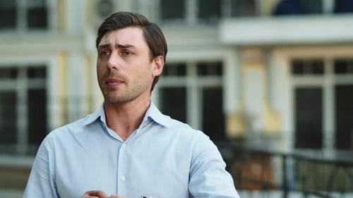 Closeup Businessman Waiting at Street. Businessman Checking Time on Wrist Watch