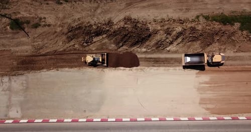 Road Construction Site Near the Highway with Machinery, Bulldozer, Excavation From Above. Video, Top