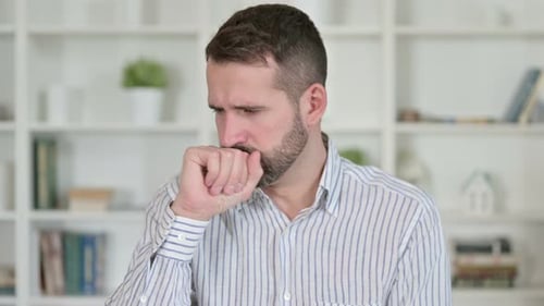 Portrait of Sick Young Man Coughing