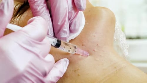 Woman Receives Injection in Neck at Clinic