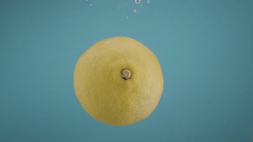 Lemon Floating Underwater in a Refreshing Blue Scene