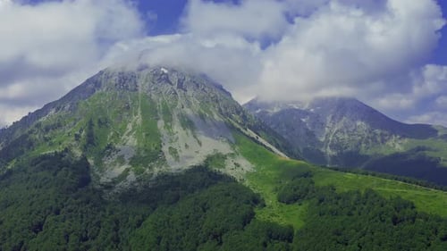 Beautiful Landscape with Alpine Mountain and Clouds