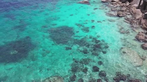Sea Surface Ripple at Sunlight with Transparent Clear Water and Visible Sandy Bottom with Underwater