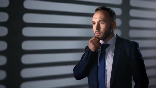 Man in Suit Pondering Important Decisions