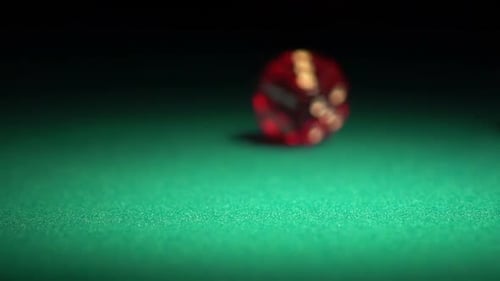 Person Throwing Red Dice on the Table, Beautiful Background for Online Casino