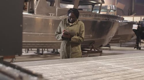 Female Engineer Inspecting Dockyard