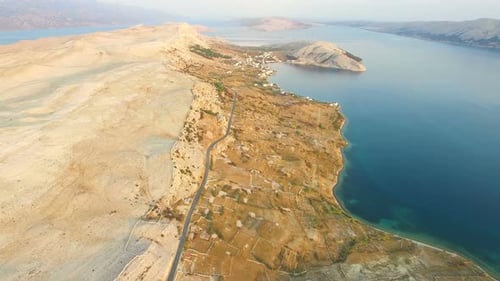 Aerial view of road through barren landscape of Pag island in Croatia