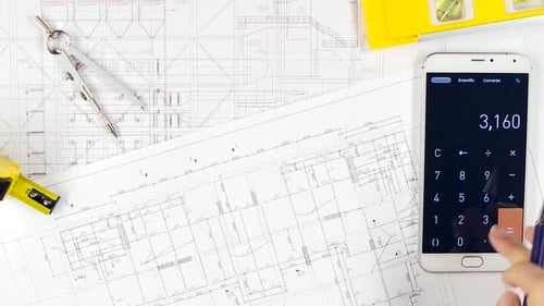 Engineers Fix Errors on Drawings, and Discuss Cooperation. Close Up