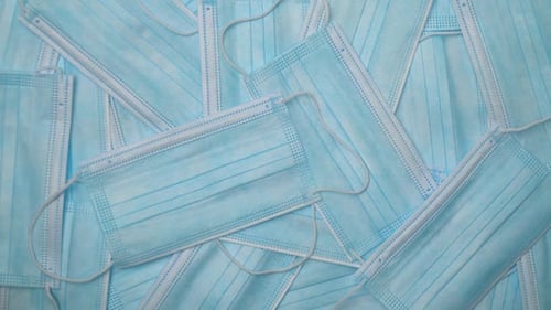 Pile of Blue Surgical Face Masks Overhead