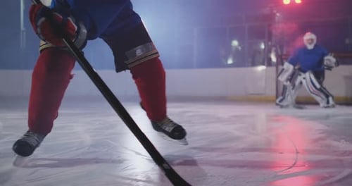 Professional Hockey Player Attacks the Gate and Strikes but the Goalkeeper Beats the Puck