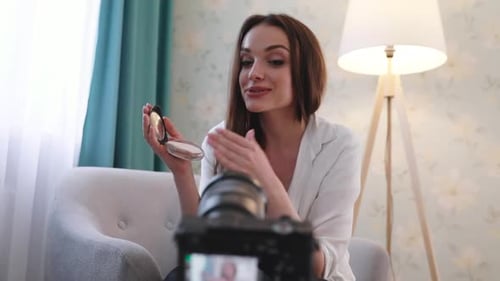 Young Woman Demonstrates Makeup in Beauty Vlog