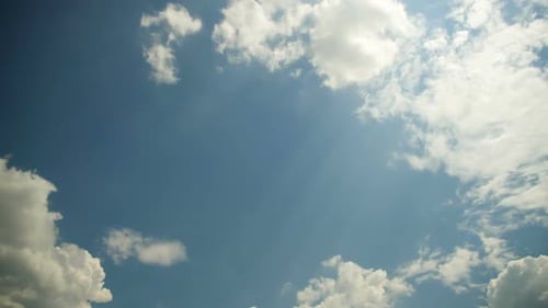 Clouds Drifting Across a Blue Sky