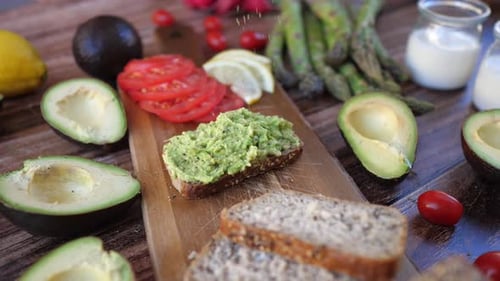 Preparing Healthy Avocado Toast with Fresh Ingredients