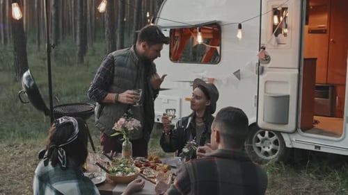 Happy Friends Having Picnic at Campground