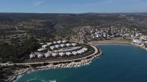 Aerial View of White Holiday Homes with Sea and Mountain Views