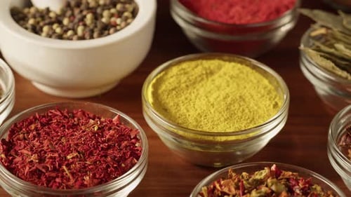 Colorful Assortment of Spices on Wood Table