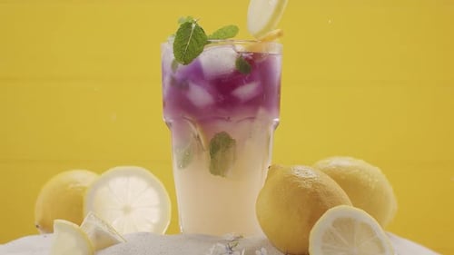 Refreshing Purple Lemonade with Fresh Mint Garnish