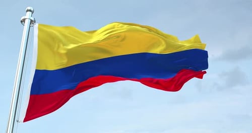 Waving Colombia Flag Animation Against Blue Sky