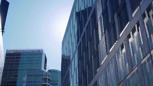 Business district building with wall mirror with blue sky