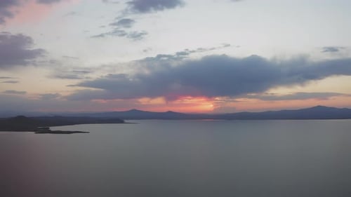 Beautiful Sunset Over the Mountain Range on the Horizon to the Sea