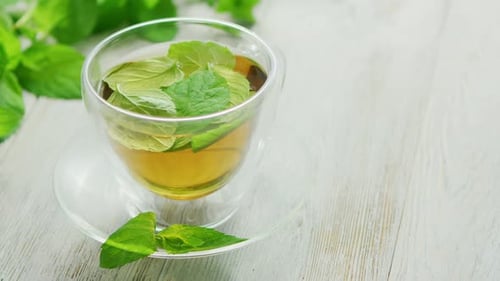Cup of Green Tea with Mint and Lemon