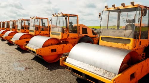 An endless row of yellow big road rollers standing in the row. Heavy machines.