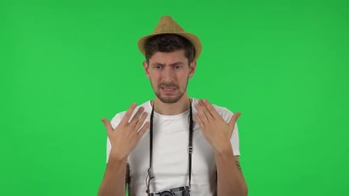 Man Expressing Frustration Against Green Screen