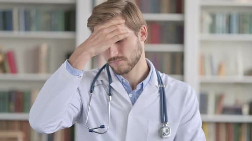 Stressed Doctor Suffering from Headache or Migraine