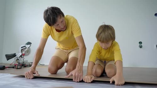 Father and Son Install Laminate Flooring Together