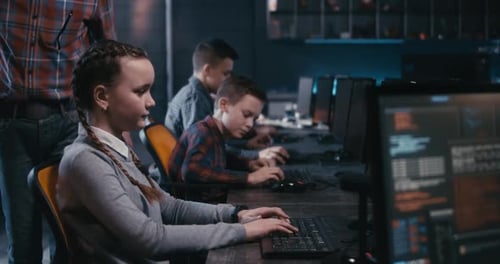 Student and Teacher Discussing Programming in School