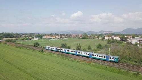 Train Travels Through Green Countryside Landscape