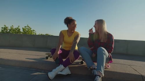Young Women Chatting in an Urban Park