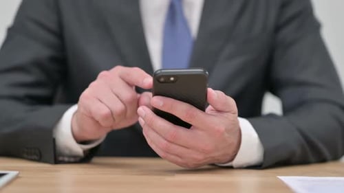 Businessman Using Smartphone Close Up