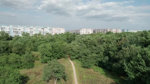 Aerial View MultiStorey Buildings Near Green Forest in Residential Area at City