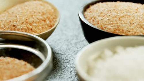 Ingredients in Bowls: Salt and Brown Sugar Crystals