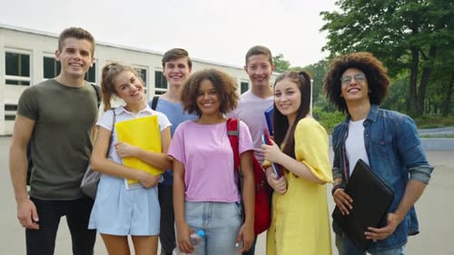 Group of Students Giving Thumbs Up at School