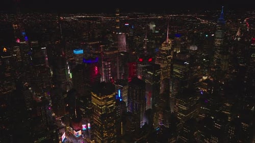 Aerial Panoramic View of Night City with Illuminated Skyscrapers