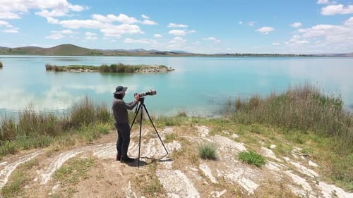 Photographer Shooting By The Lake