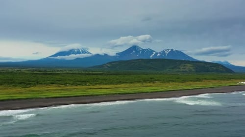 Beach with Black Sand and Volcano
