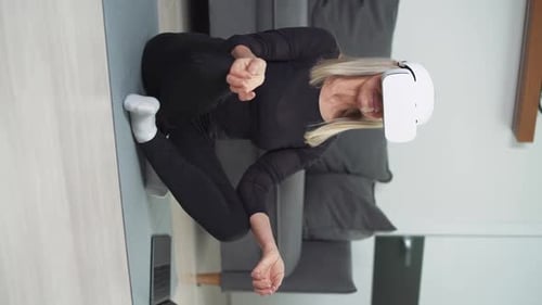 Woman Using VR Headset to Exercise at Home
