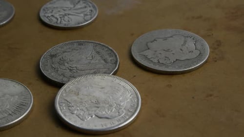 Rotating stock footage shot of antique American coins - MONEY 0050