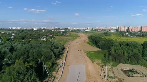 Special construction machinery, building new road in the suburbs - drone footage