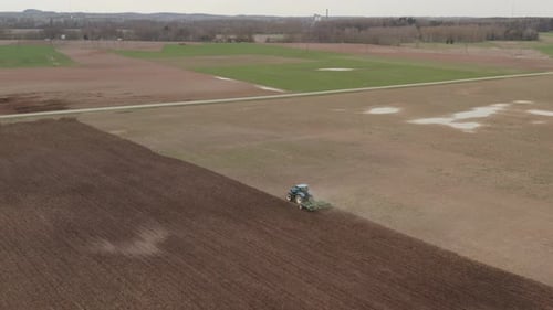 The Tractor Plows the Field Prepares for Crops
