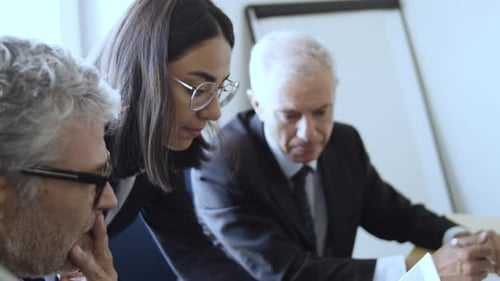 Young Female Financial Expert Explaining Charts