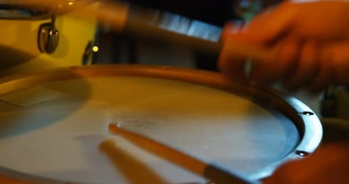 Drummer playing drum in studio
