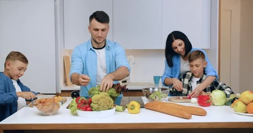Family Cooking Together in a Bright Kitchen