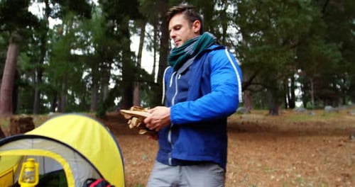 Hiker couple preparing a camp fire